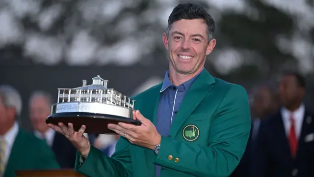 Rory McIlroy celebrates with his trophy at the Masters