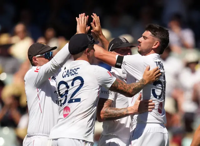 Josh Tongue celebrates the wicket of Josh Inglis