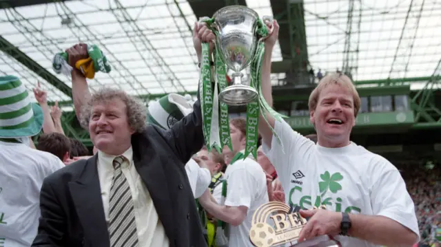 Celtic manager Wim Jansen (left) and assistant Murdo MacLeod celebrate with the Bell's Premier Division championship trophy