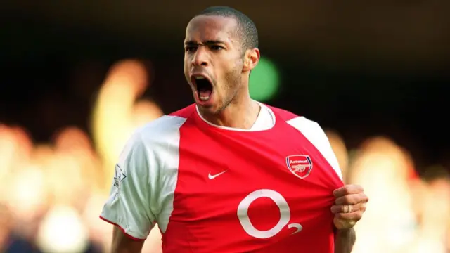 Thierry Henry celebrates scoring a goal for Arsenal