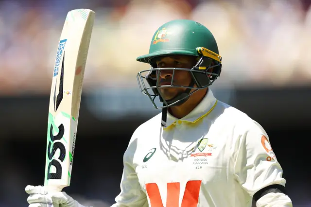 Usman Khawaja acknowledges the crowd after making 82