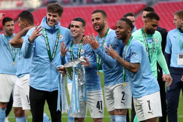 Manchester City celebrate four League Cup trophies in a row