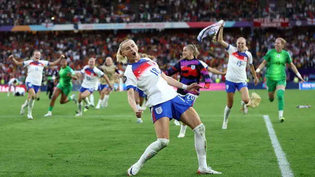 Chloe Kelly celebrates after scoring the winning penalty at Euro 2025