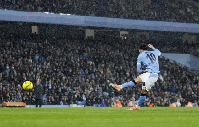 Rayan Cherki strikes the ball