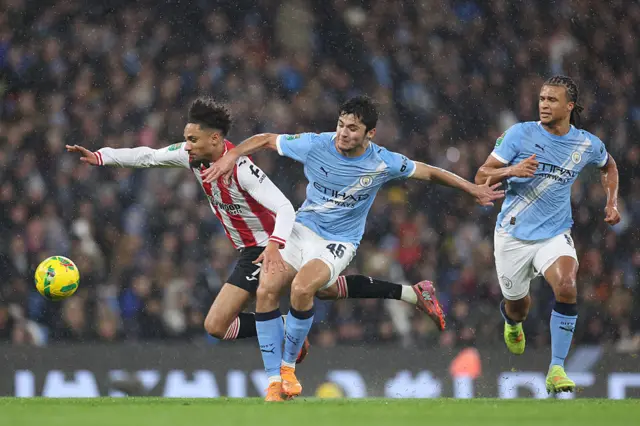 Kevin Schade of Brentford is fouled by Abdukodir Khusanov