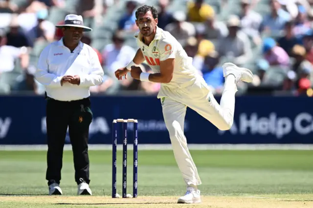 Mitchell Starc bowls
