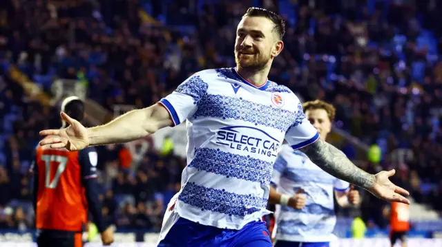 Jack Marriott celebrates with his arms outstretched
