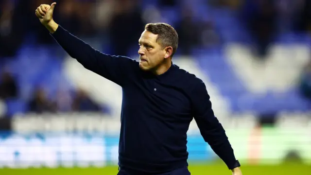 Reading boss Leam Richardson gives a thumbs up to the Royals fans