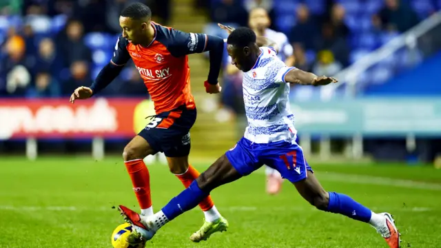 Luton's Cohen Bramall takes on Reading defender Andy Yiadom