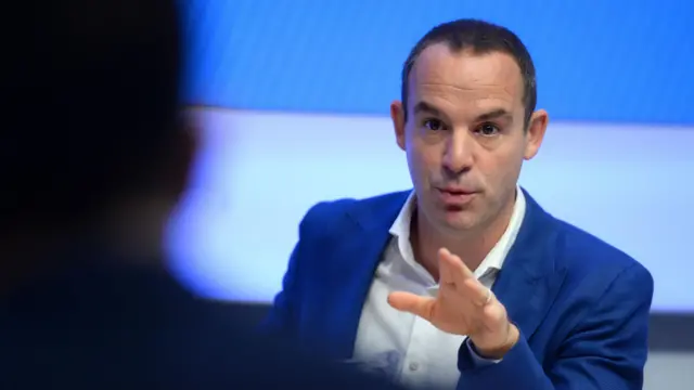 Martin Lewis in a blue jacket