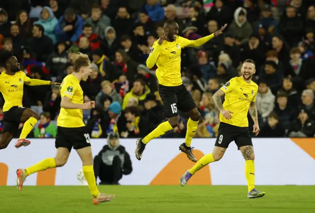 KuPS' Ibrahim Cisse celebrates scoring their second goal with Piotr Parzyszek during UEFA Conference League - Crystal Palace v KuPS - Selhurst Park.