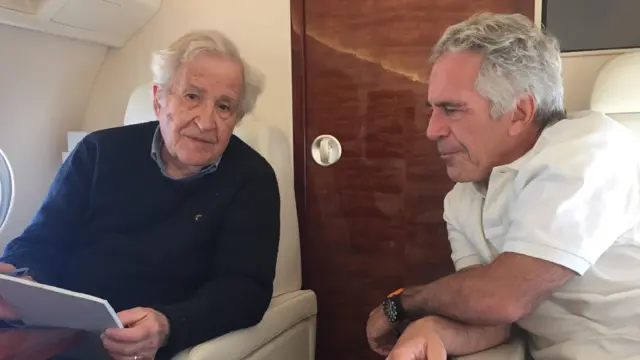 Epstein sitting alongside renowned linguist Noam Chomsky on what appears to be an aircraft