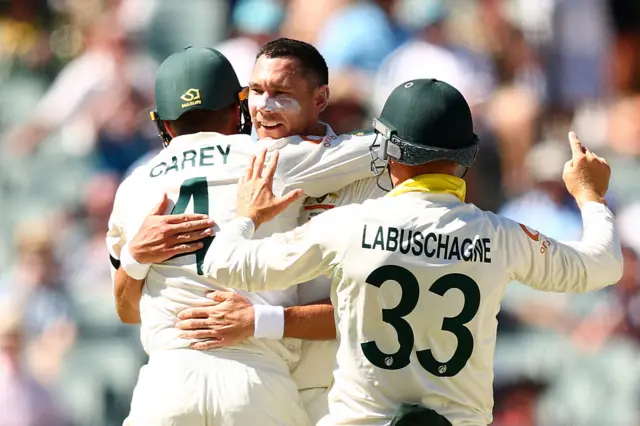 Scott Boland and Alex Carey celebrate