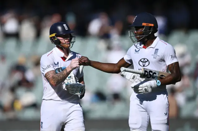 Ben Stokes and Jofra Archer punch hands at the end of day two
