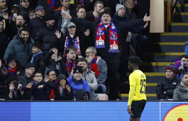 KuPS' Clinton Antwi walks off the pitch after being shown a red card as Crystal Palace fans react during  UEFA Conference League - Crystal Palace v KuPS - Selhurst Park, London.