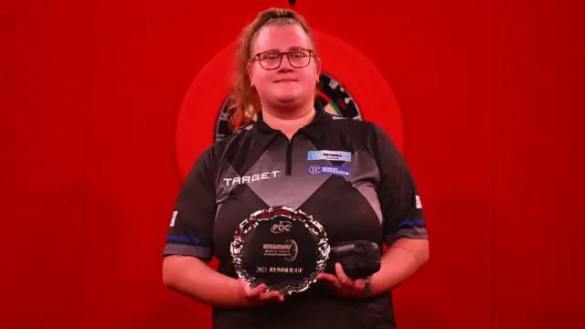 Beau Greaves with her World Youth Championship runner-up trophy