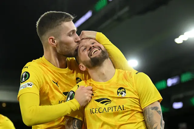 Piotr Parzyszek of KuPS Kuopio celebrates scoring his team's first goal with teammate Doni Arifi during the UEFA Conference League 2025/26 League Phase