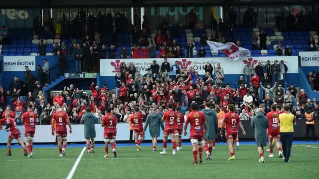 Scarlets celebrate with their fans after winning at Cardiff Arms Park