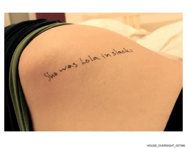 A message written in pen that reads: She was Lola in slacks"