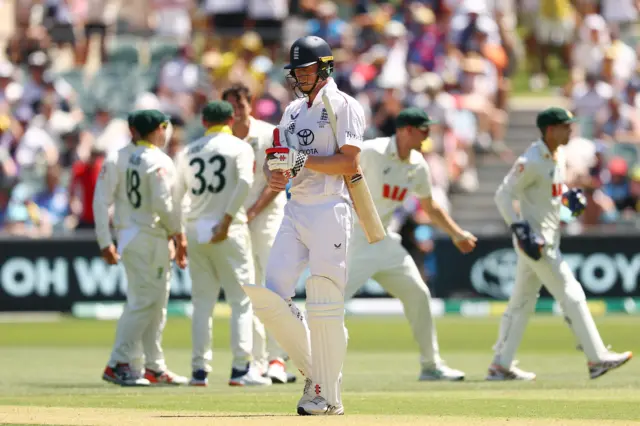 Zak Crawley walks off after being dismissed by Pat Cummins