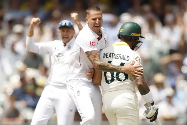 Brydon Carse bumps into Jake Weatherald while celebrating a wicket
