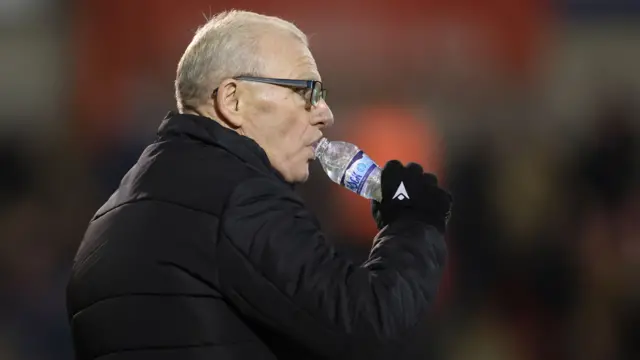 Steve Evans drinking water from a bottle