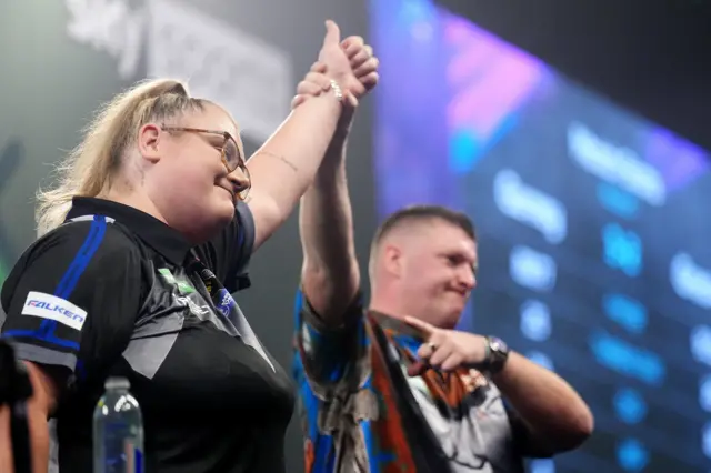 Daryl Gurney celebrates with Beau Greaves