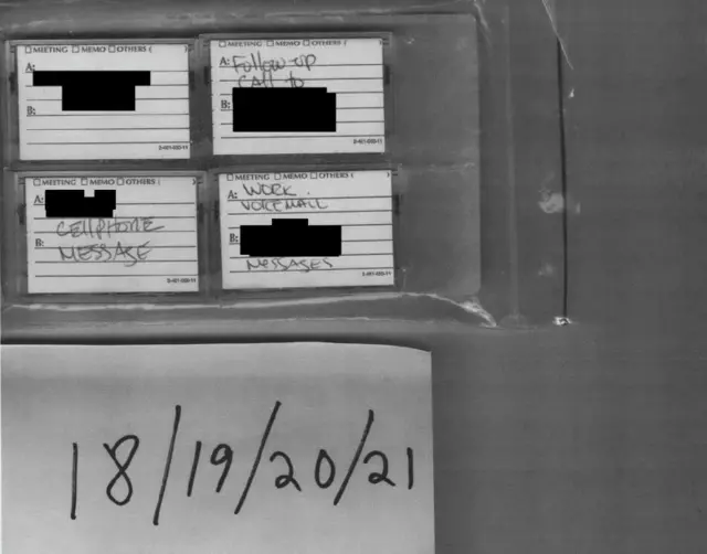 A black and white image showing audio tapes with the date listed as 18/19/20/21