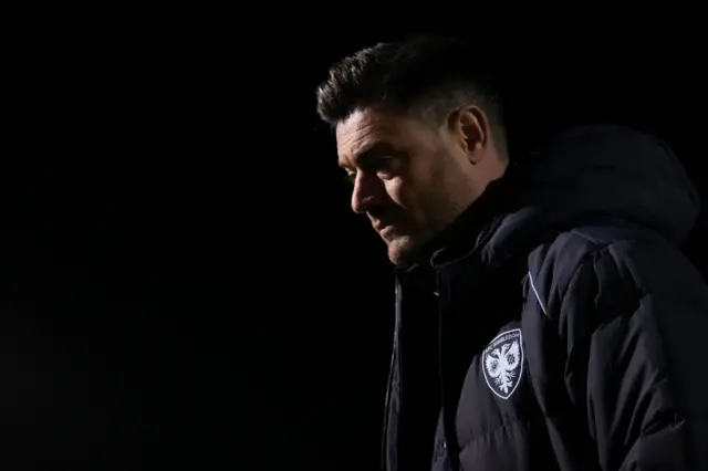 AFC Wimbledon boss Johnnie Jackson before kick-off at Northampton