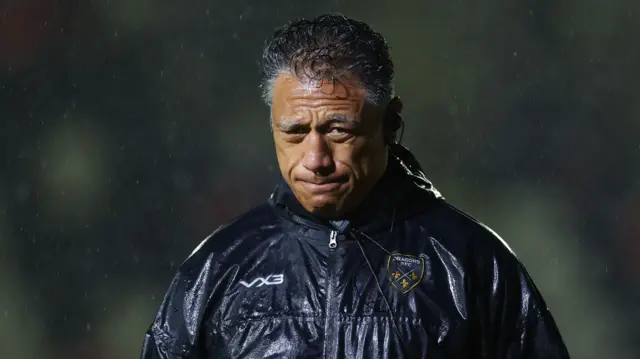 Dragons head coach Filo Tiatia in the rain at Rodney Parade