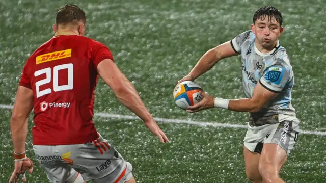 Dan Edwards passes the ball for Ospreys against Munster