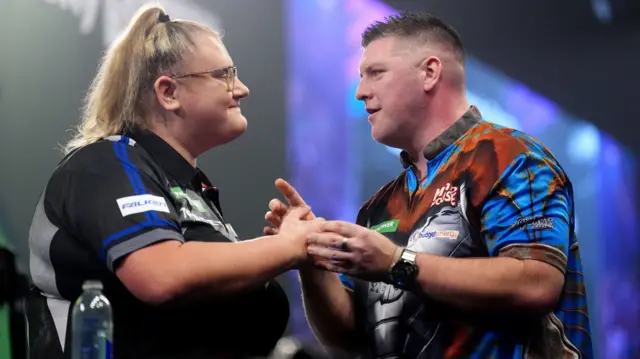 Beau Greaves shakes hands with Daryl Gurney