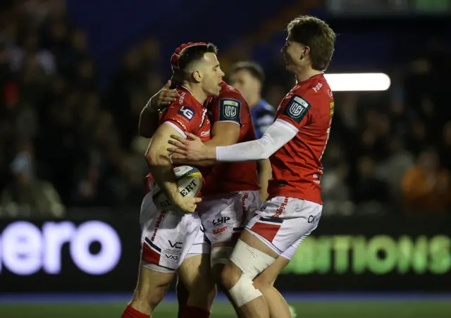 Scarlets celebrate Gareth Davies scoring a try at Cardiff