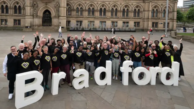 Volunteers at City Park in Bradford join together to celebrate the launch of Bradford 2025 UK City of Culture.
