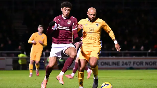 Northampton's Ethan Wheatley and Ryan Johnson battle for possession