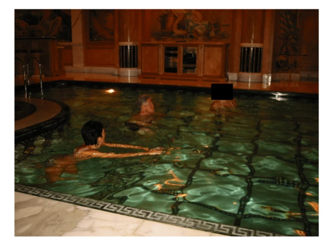 Image shows Bill Clinton in a swimming pool