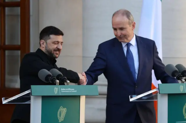 President Zelensky shakes hands with Taoiseach Micheal Martin