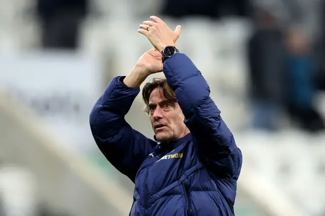 Thomas Frank, Manager of Tottenham Hotspur, applauds the fans