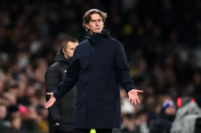 Tottenham manager Thomas Frank with his arms out wide