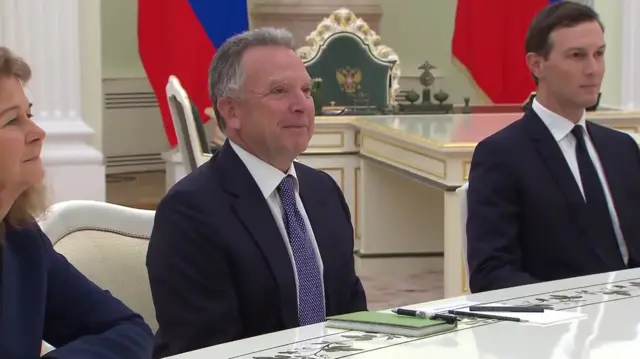 Witkoff looking across the table at Putin who is out of frame, with  Jared Kushner to his right