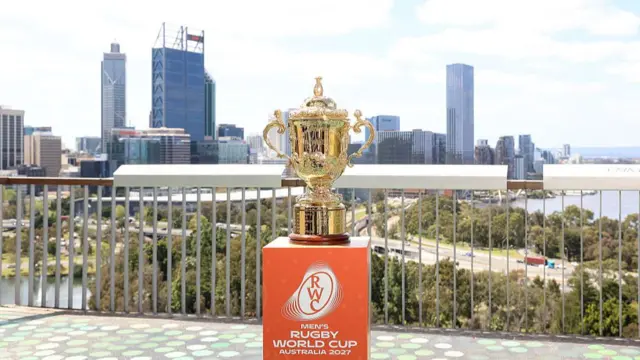 The Rugby World Cup on display in Perth, Australia. The Perth skyline is in the background.