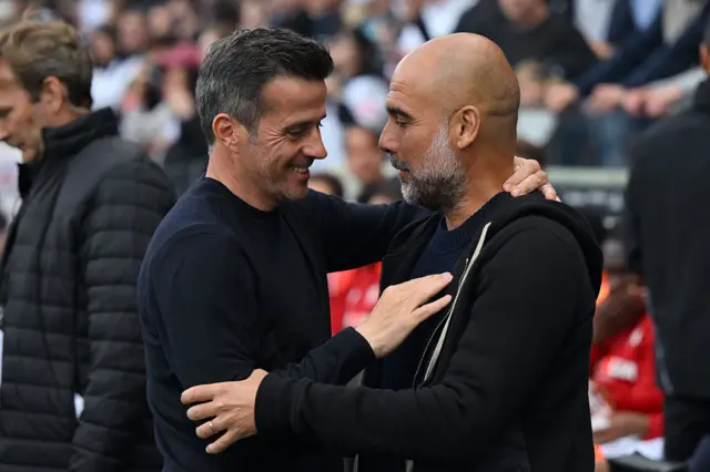 Marco Silva and Pep Guardiola hug