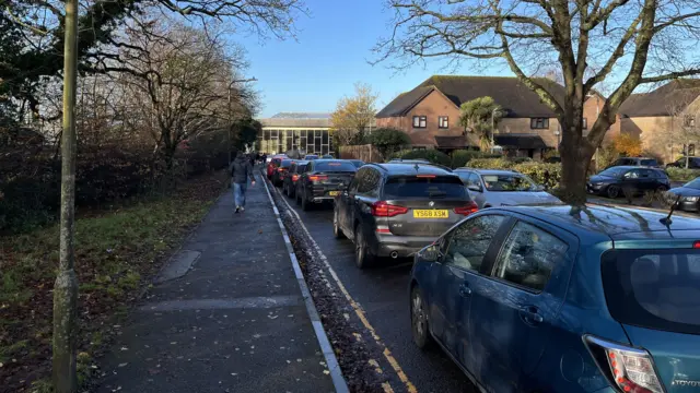 Cars queuing on a street