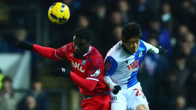 Ipswich's Cedric Kipre competes for a header with Blackburn's Yuki Ohashi