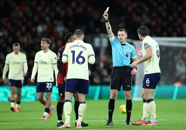 Vitaliy Mykolenko is shown a yellow card