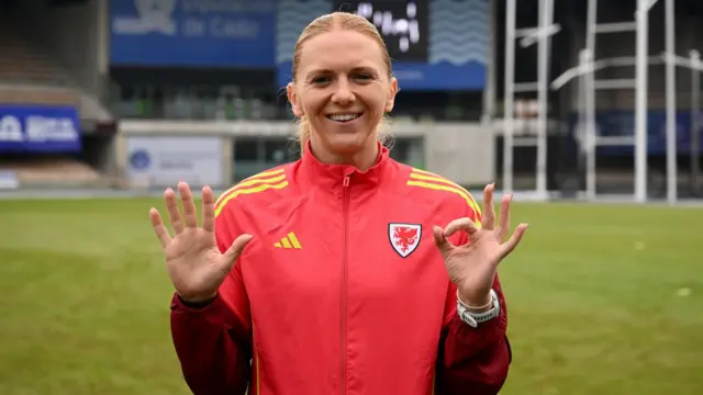Ceri Holland holds up 5-0 for her 50th cap