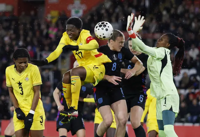 England's Lucia Kendall in action with Ghana's Portia Boakye and Cynthia Konlan