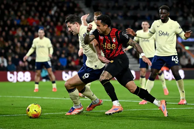 Justin Kluivert is held by James Tarkowski