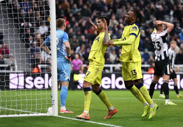 Cristian Romero of Tottenham Hotspur (L) celebrates scoring his team's second goal
