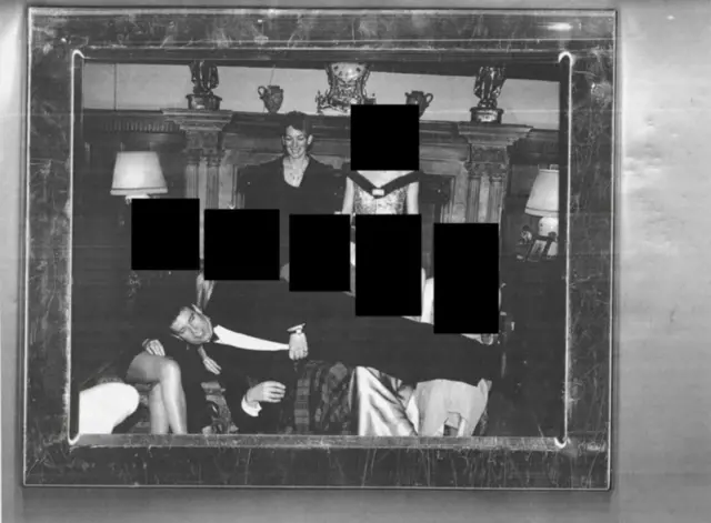 A photo in the released files appears to show former prince Andrew laying across five people, Ghislaine Maxwell is seen standing behind them.